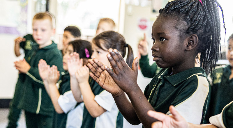 Student clapping at  St Aidan's Catholic Primary School Rooty Hill