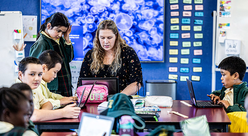 Teacher with class at St Aidan's Catholic Primary Rooty Hill