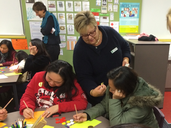 Principal Dr Elizabeth Ricketts with parents taking part in maths activities