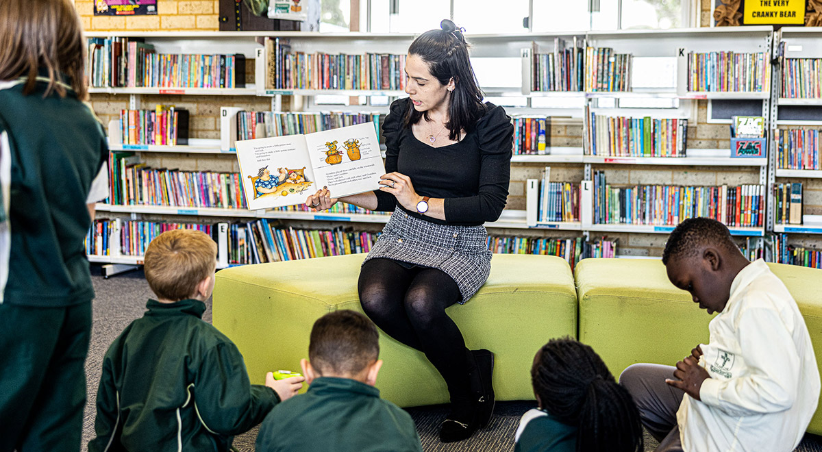 Teacher reading book to students at St Aidan's Catholic Primary School Rooty Hill