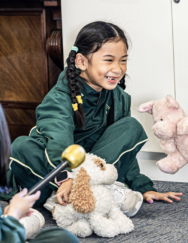 Student playing with plush toys at St Aidan's Catholic Primary School Rooty Hill