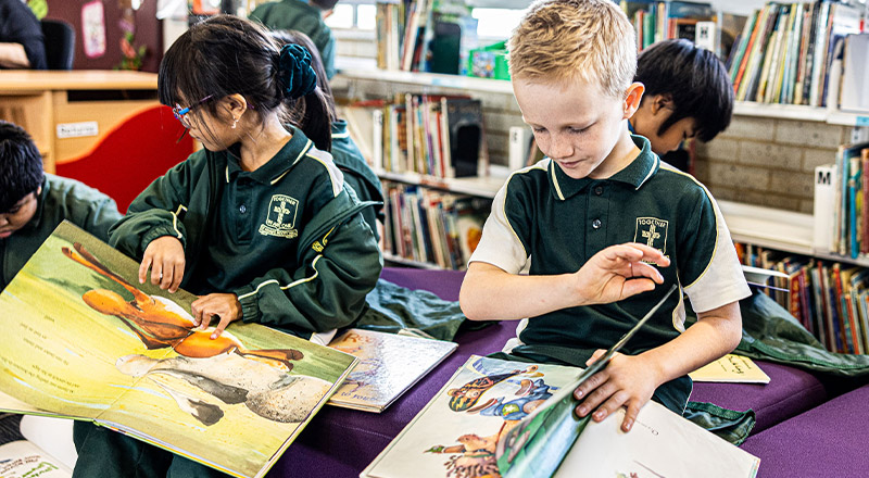 Students reading in St Aidan's Catholic Primary School Rooty Hill library