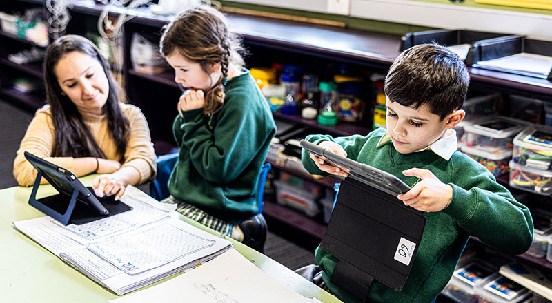 Students on iPad at St Aidan's Catholic Primary School Rooty Hill