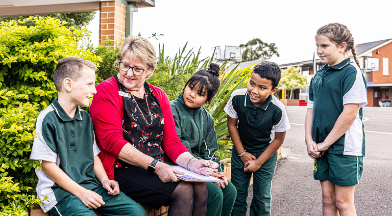 Dedicated principal Marian Bell and students from St Aidan's Catholic Primary School Rooty Hill