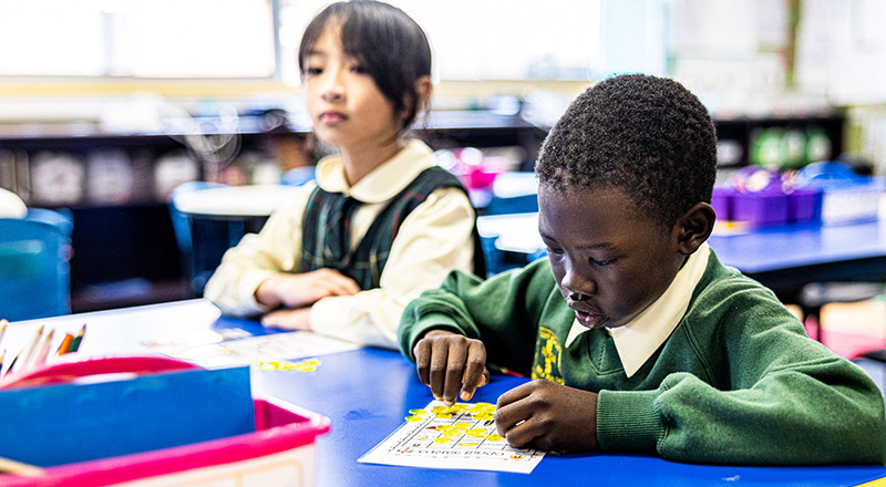 Student playing bingo at St Aidan's Catholic Primary School Rooty Hill