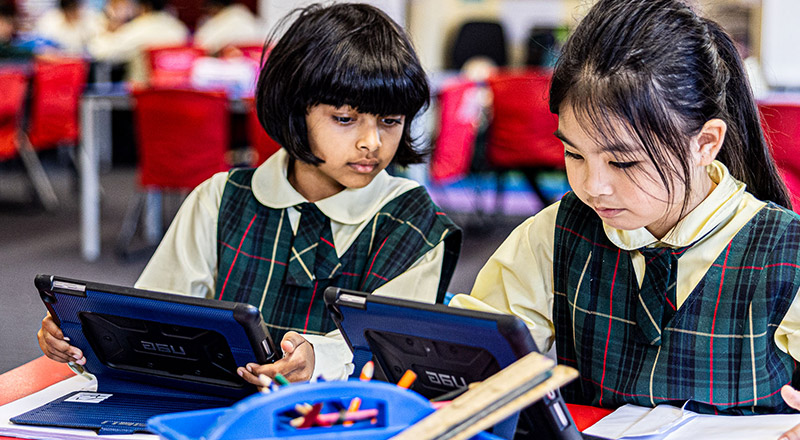Students on iPads at St Aidan's Catholic Primary School Rooty Hill