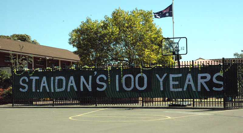 St Aidan's Catholic Primary School Rooty Hill banner celebrating 100 year anniversary