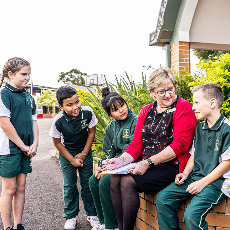 Dedicated principal Marian Bell and students from St Aidan's Catholic Primary School Rooty Hill