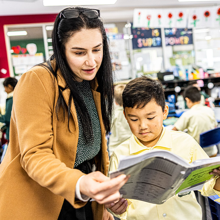 Teacher with student at St Aidan's Primary Rooty Hill