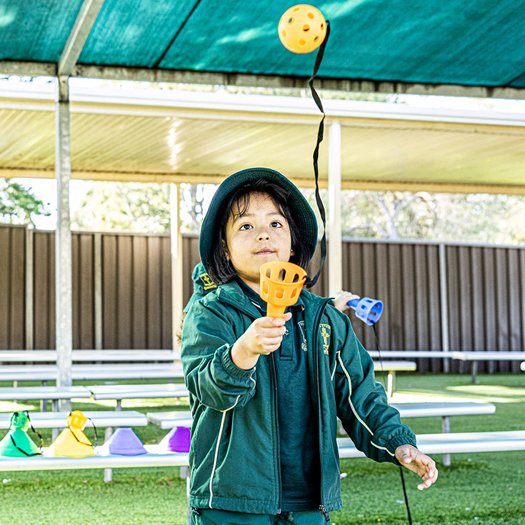 Student playing in shaded outside area at St Aidan's Catholic Primary School Rooty Hill